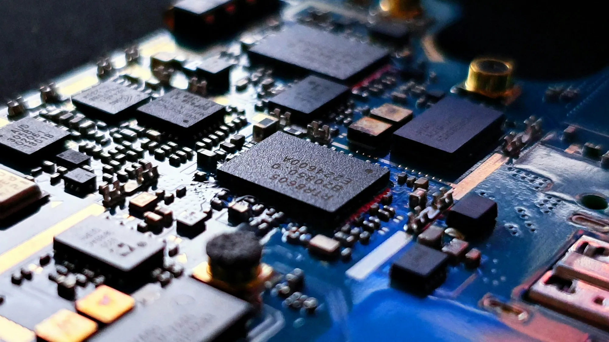 Macro view of densely assembled processing and power components on a blue circuit board, used as China BOM ecosystem context.